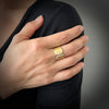Wide ring with 18K yellow gold with pave set diamonds shown on model made by Ayesha Mayadas