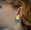 Doublet opal drops hanging from 18K yellow gold square, textured tops shown on model Made by Ayesha Mayadas