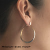 Medium size Splash Hoop off round Earrings in 14K yellow hammered Gold overlay on Silver shown on model by Ayesha Mayadas