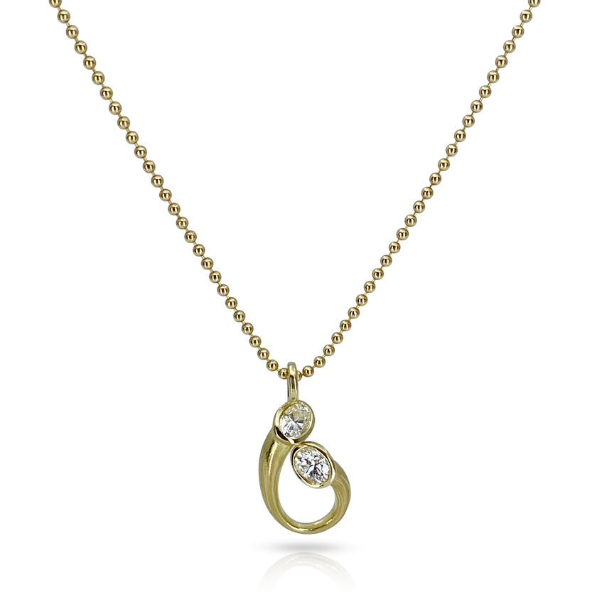 18Kt and oval diamond pendant in an embrace motif or mother and child motif.  Made by Ayesha Mayadas