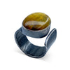 Wide oval shaped Nellite ring with a tiger&#39;s eye appearance in wafer textured sterling silver by Ayesha Mayadas