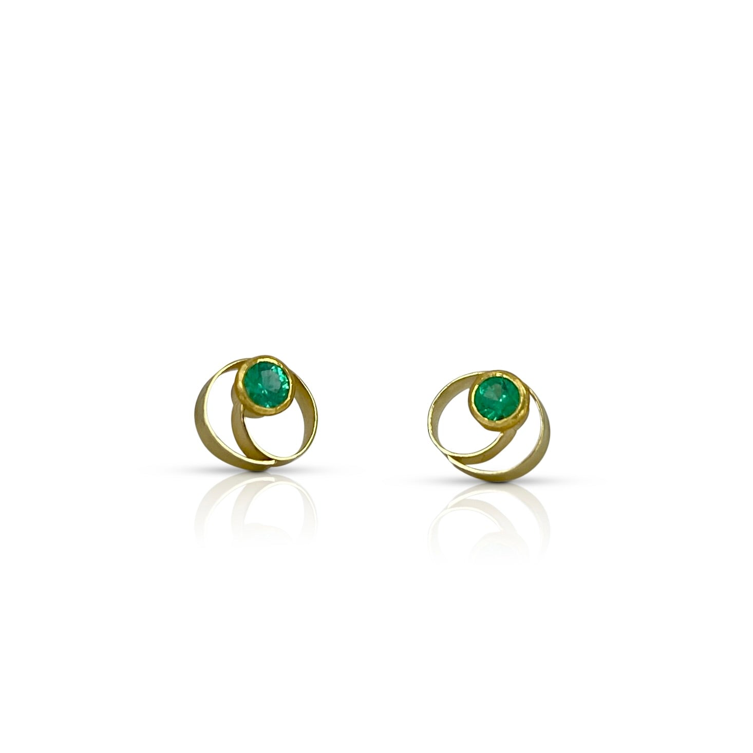 Coil style stud earrings in 18K and 22K yellow gold with emeralds by Ayesha Mayadas