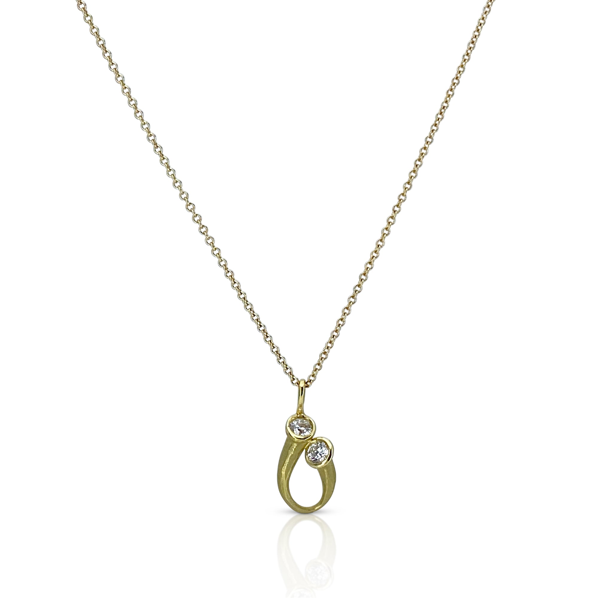 Delicate tear drop pendant in gold with round diamonds by Ayesha Mayadas