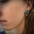 Facet Edge Stud earrings in sterling silver shown on model made by Dahlia Kanner