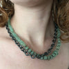 Necklace of Emerald rondelle beads with sterling silver spacers and sterling silver chain shown on model made by Ayesha Mayadas