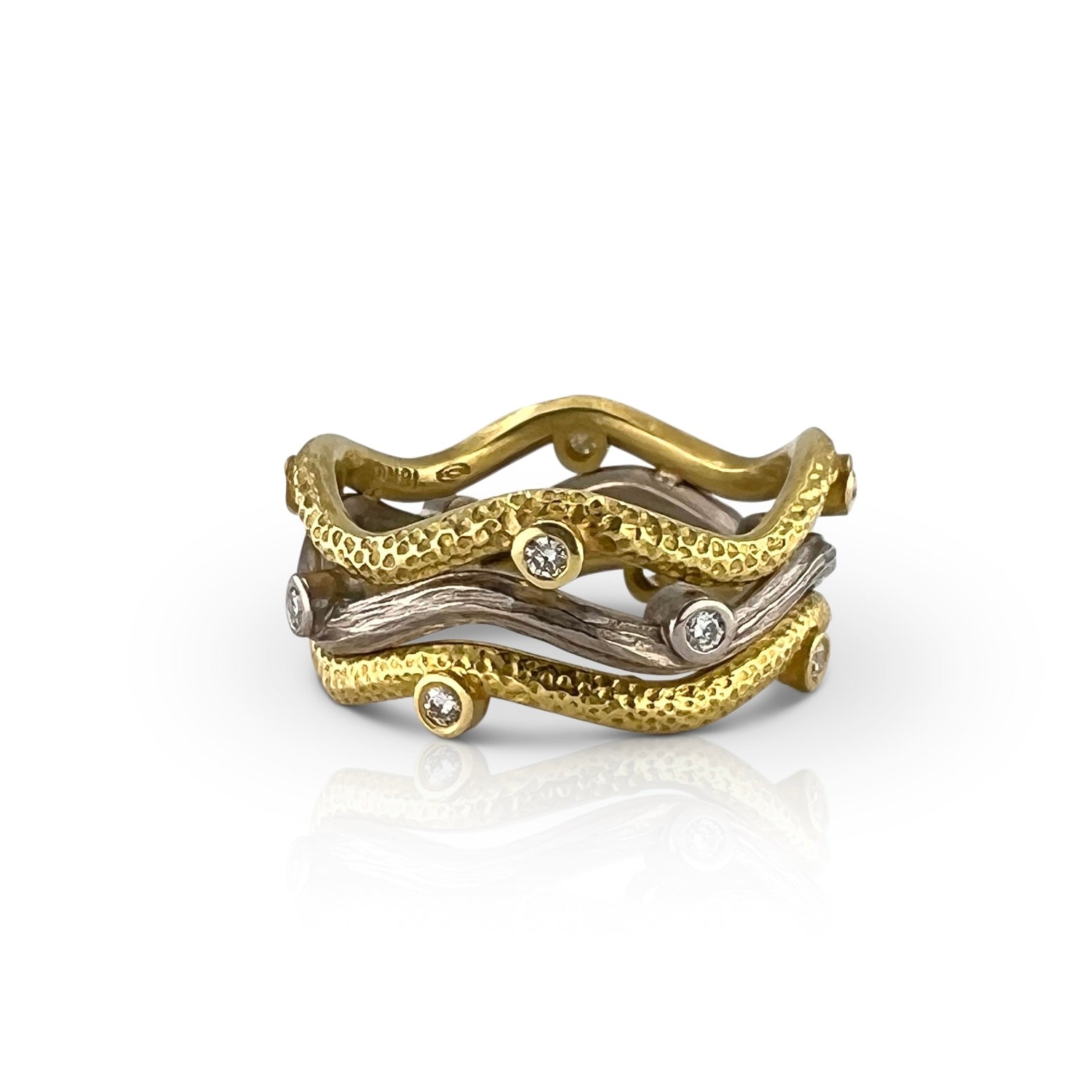 Triple wave Serpentine ring in yellow and white gold with diamonds