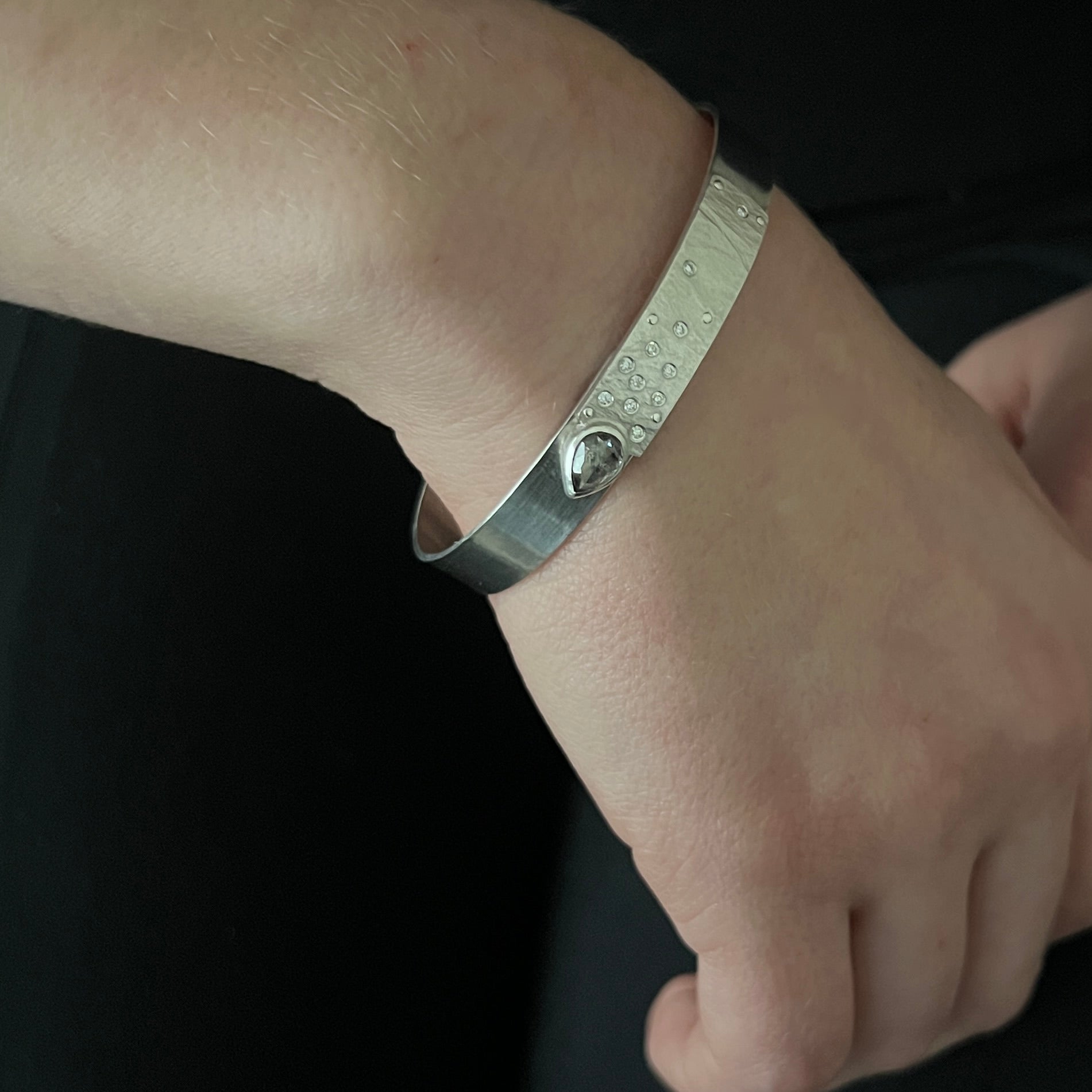 Narrow forged cuff (#2) in sterling silver with top closure and natural raw diamond