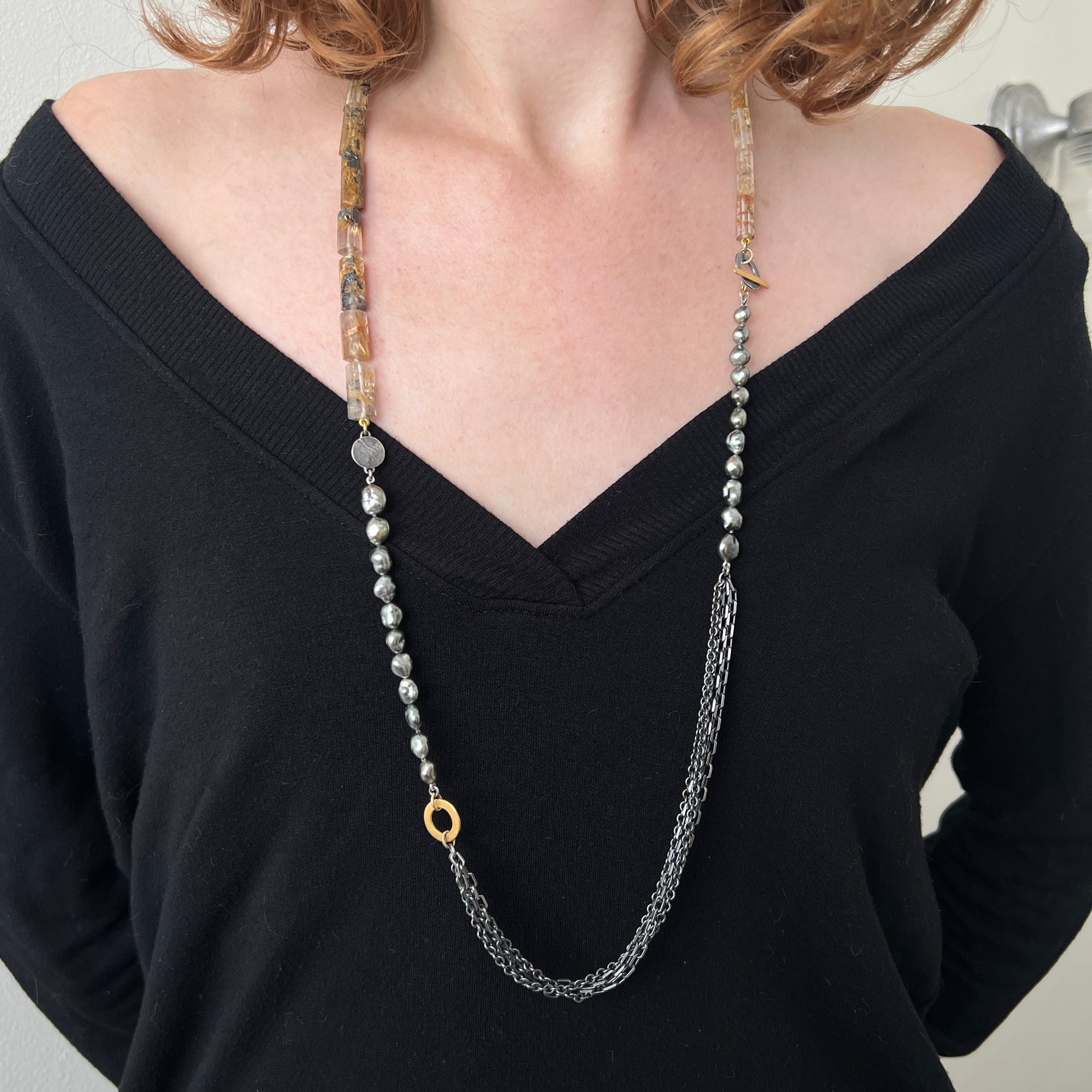 An eclectic necklace of rutilated quartz, South Sea pearls, oxidized sterling silver and vermeil