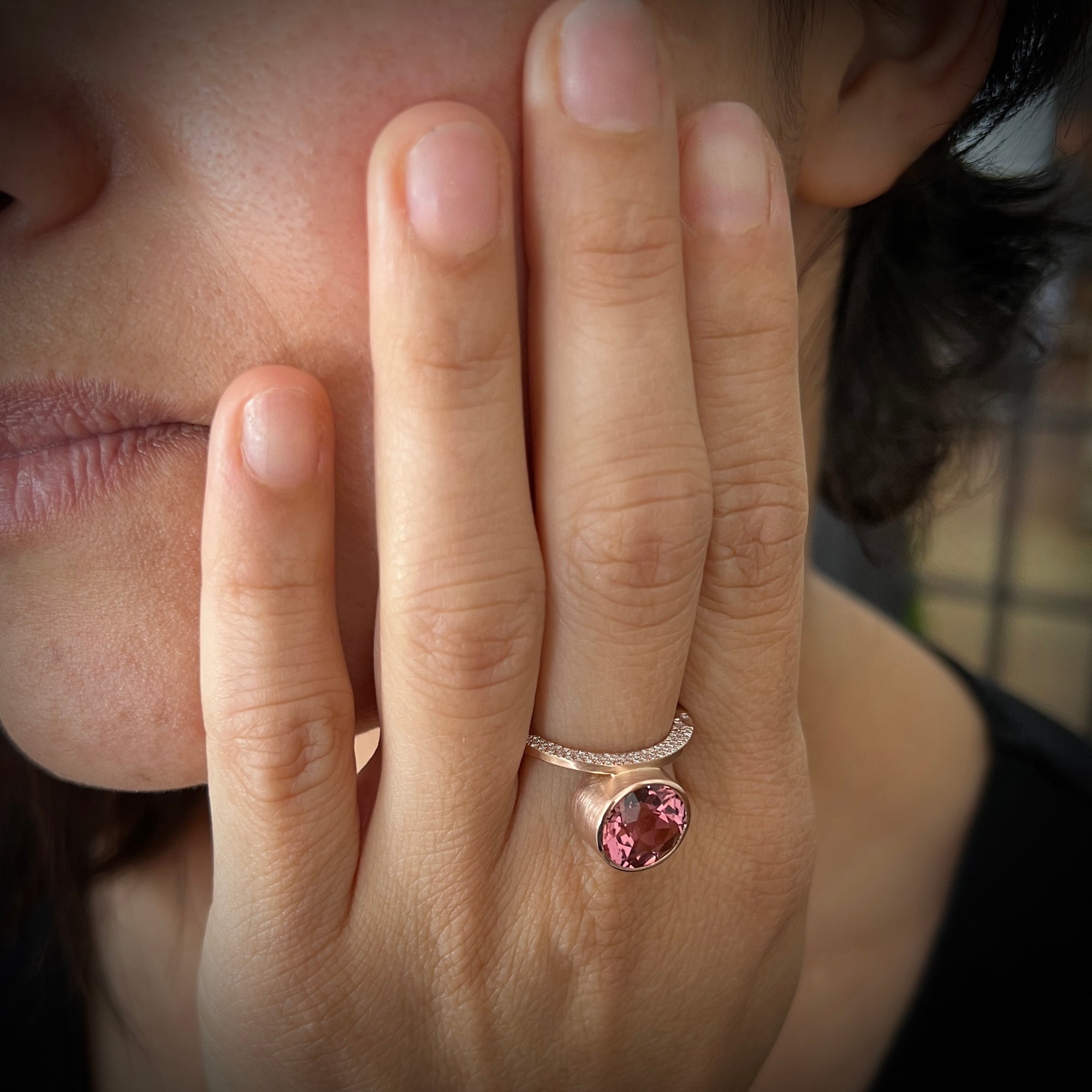 Cocktail ring in 18K pink gold with large faceted pink tourmaline and pave set diamonds made by Ayesha Mayadas