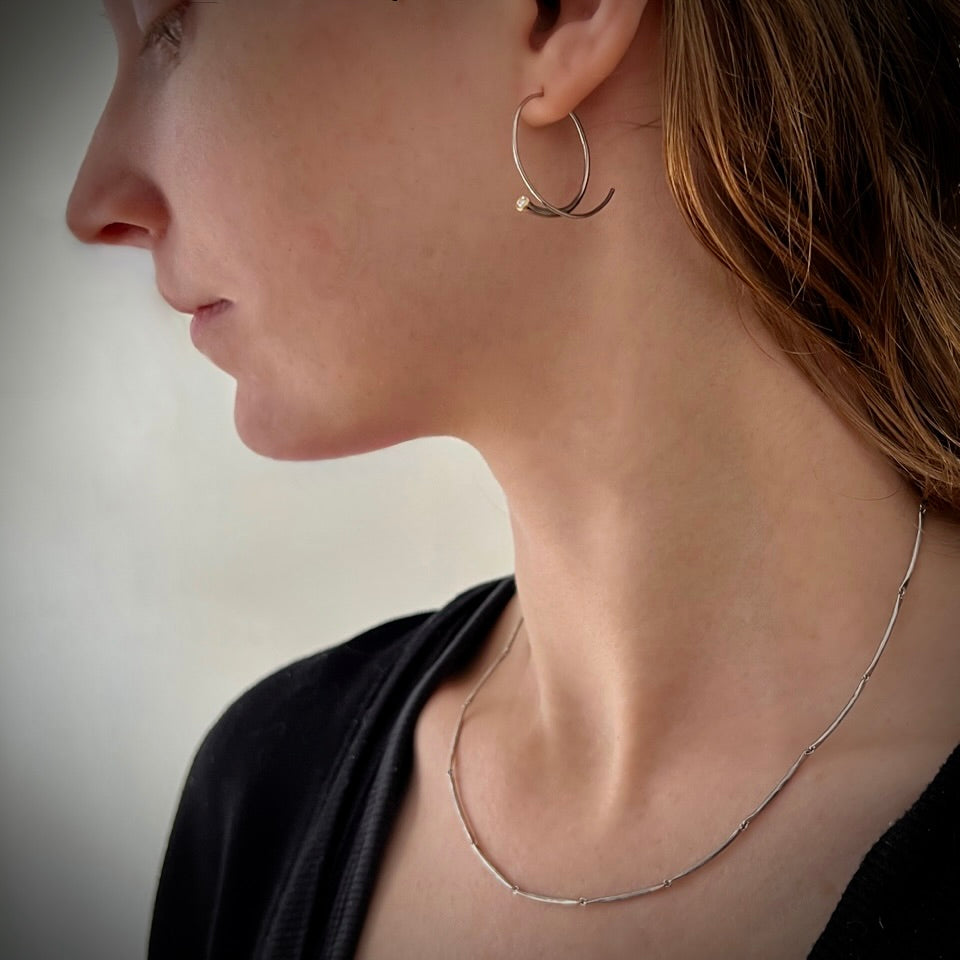 A delicate flowing necklace , hand forged in 18KY gold with platinum links by Ayesha Mayadas