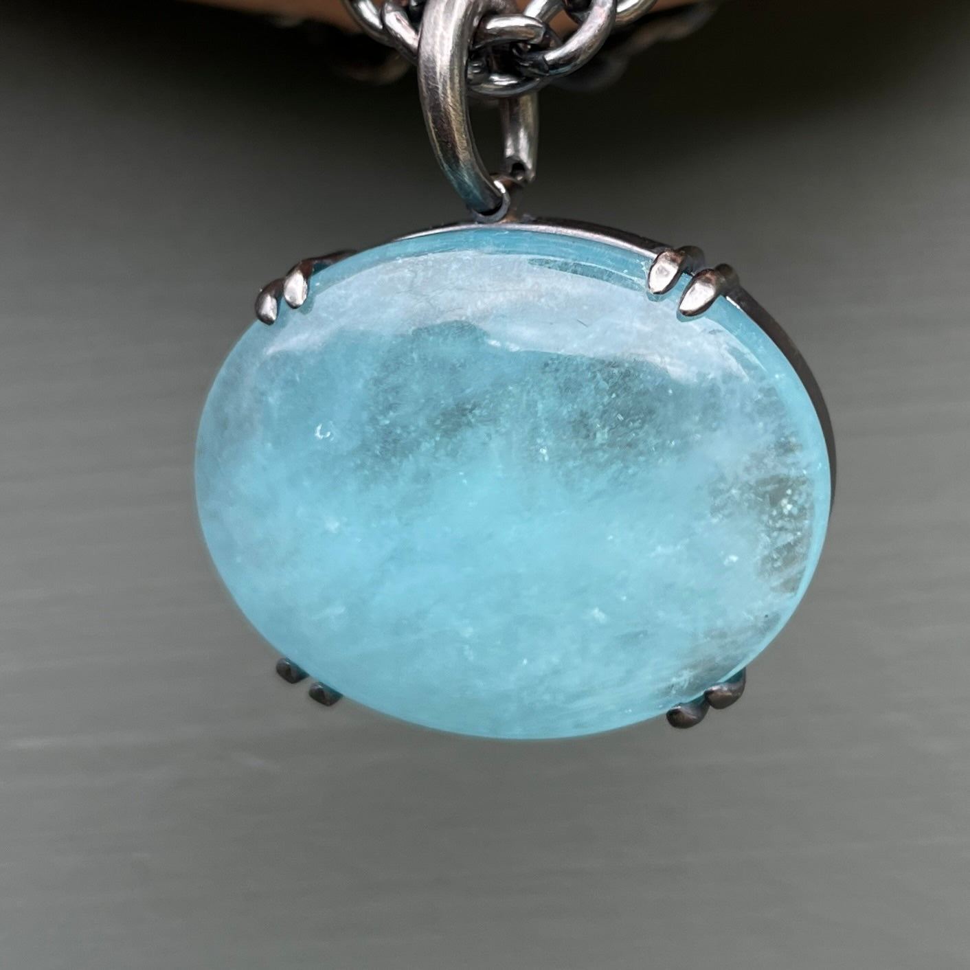 Large luminescent aquamarine pendant on a multistrand chain