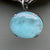 Large luminescent aquamarine pendant on a multistrand chain