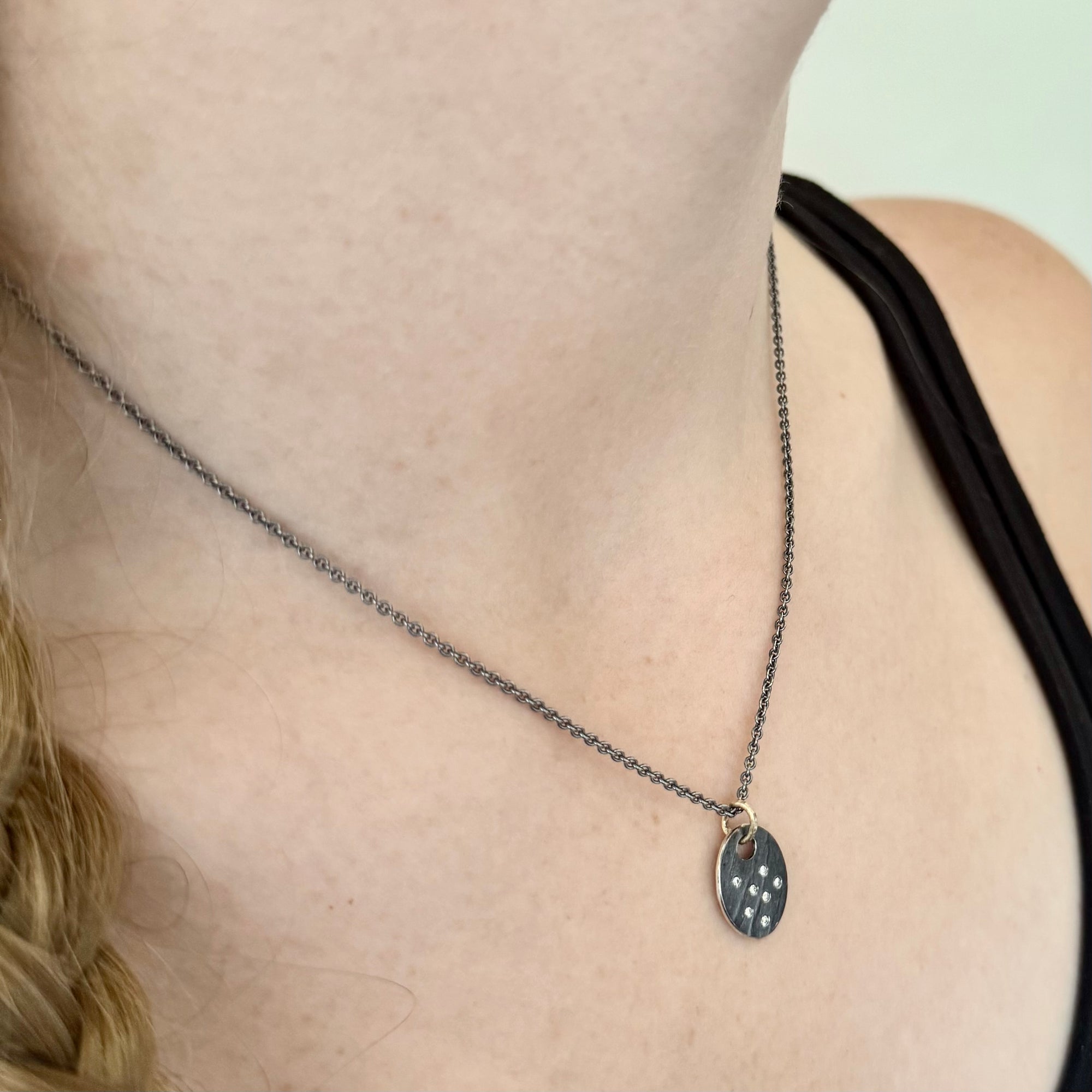 Oval disc pendant in Sterling Silver with diamonds