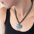 Large luminescent aquamarine pendant on a multistrand chain