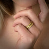 Triple layer wave band in 18K yellow gold with 24 diamonds shown on model by Ayesha Mayadas