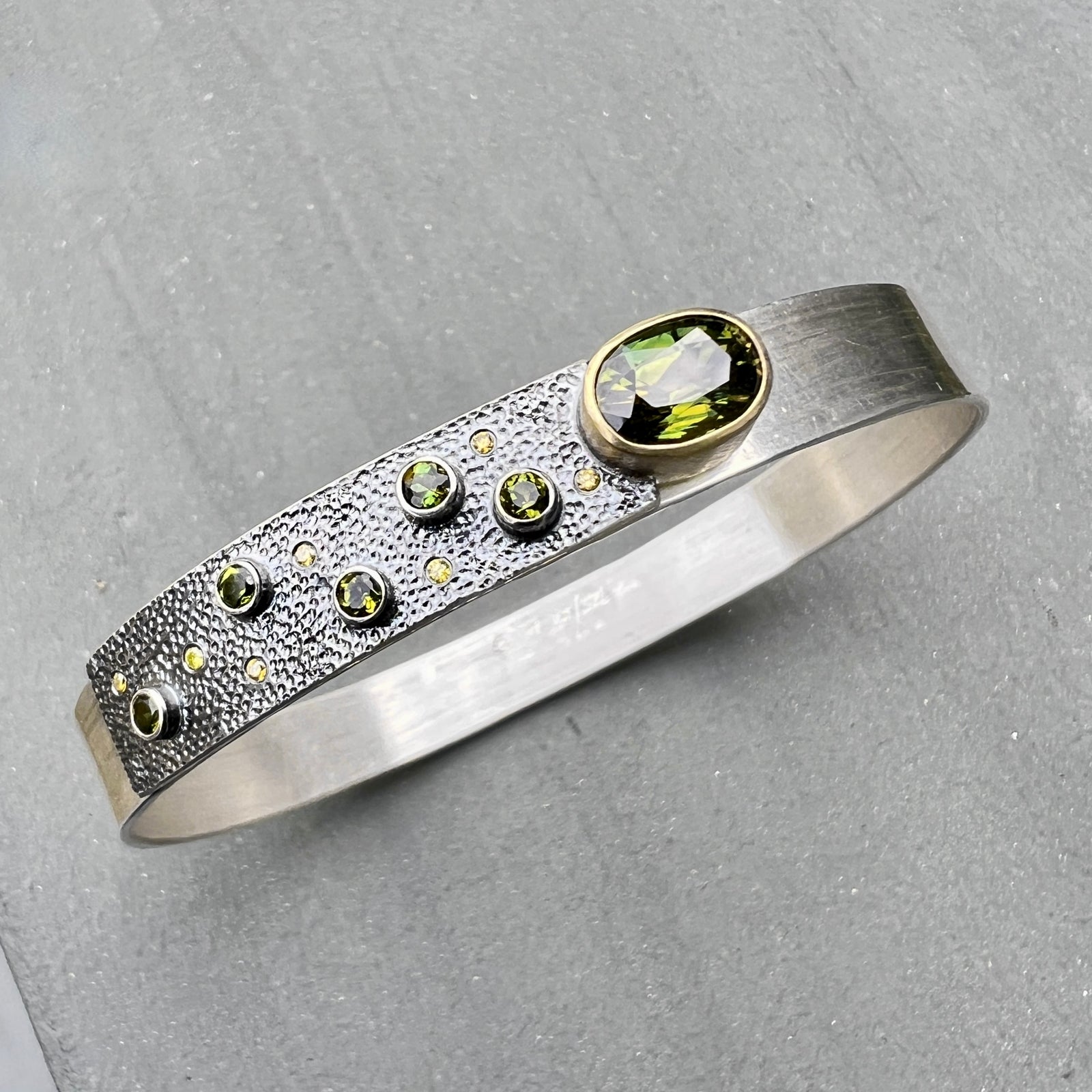 Narrow forged cuff (#2) in sterling silver with top closure and tourmalines and diamonds