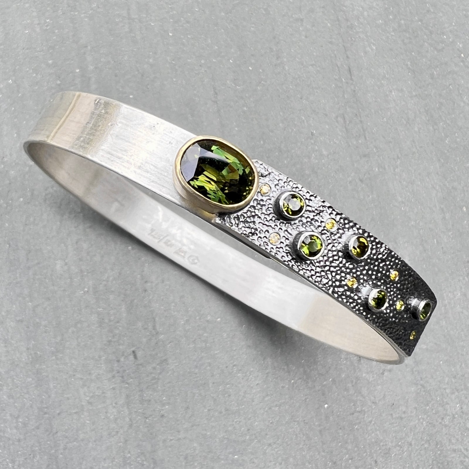 Narrow forged cuff (#2) in sterling silver with top closure and tourmalines and diamonds