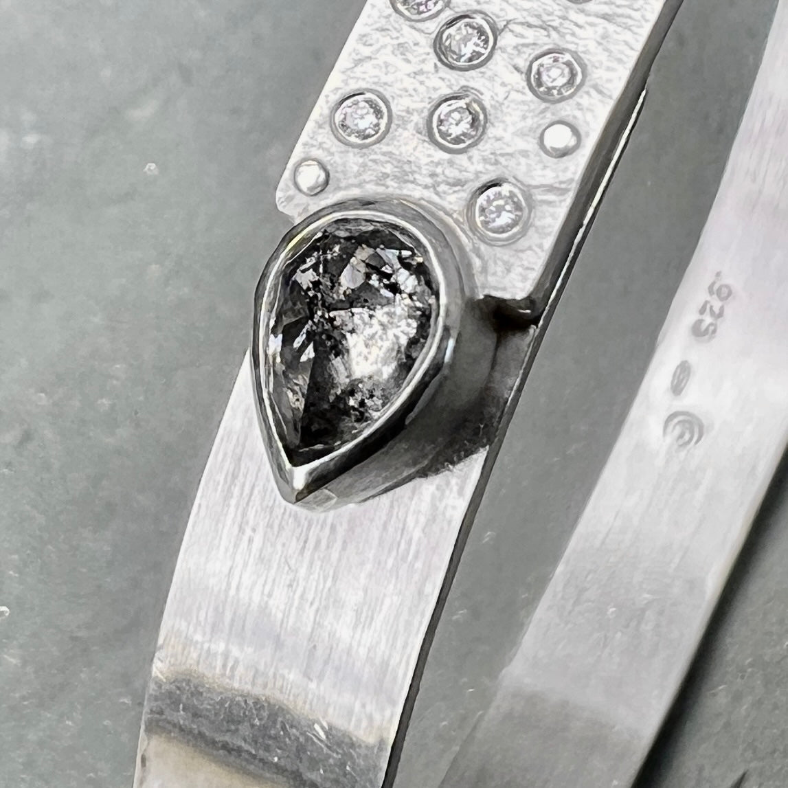 Narrow forged cuff (#2) in sterling silver with top closure and natural raw diamond