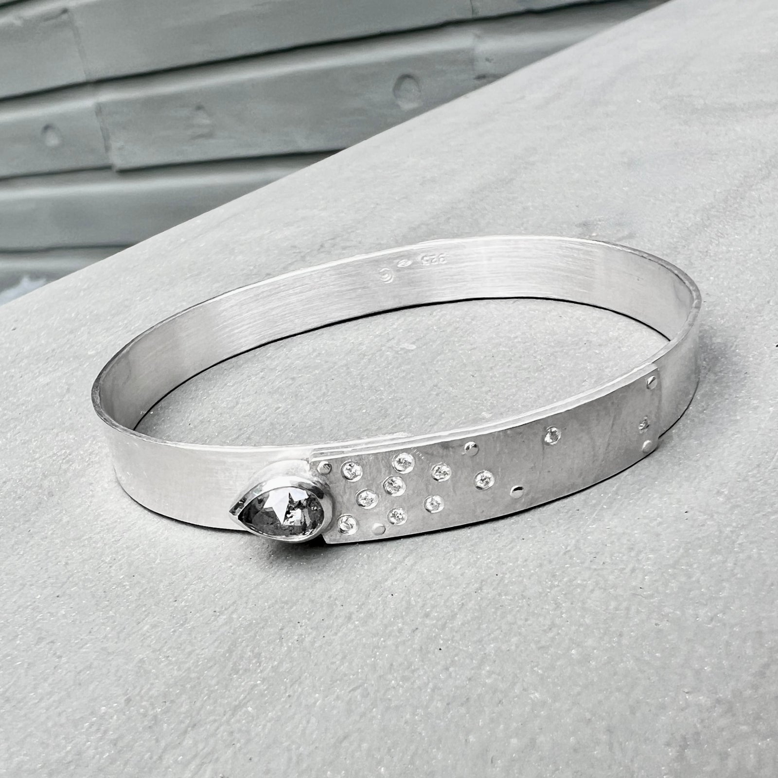 Narrow forged cuff (#2) in sterling silver with top closure and natural raw diamond