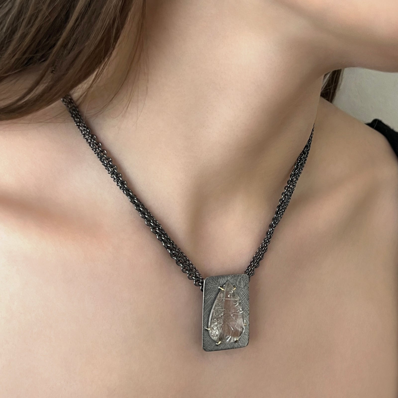 Pear shaped rutilated quartz necklace on multi-strand sterling chain