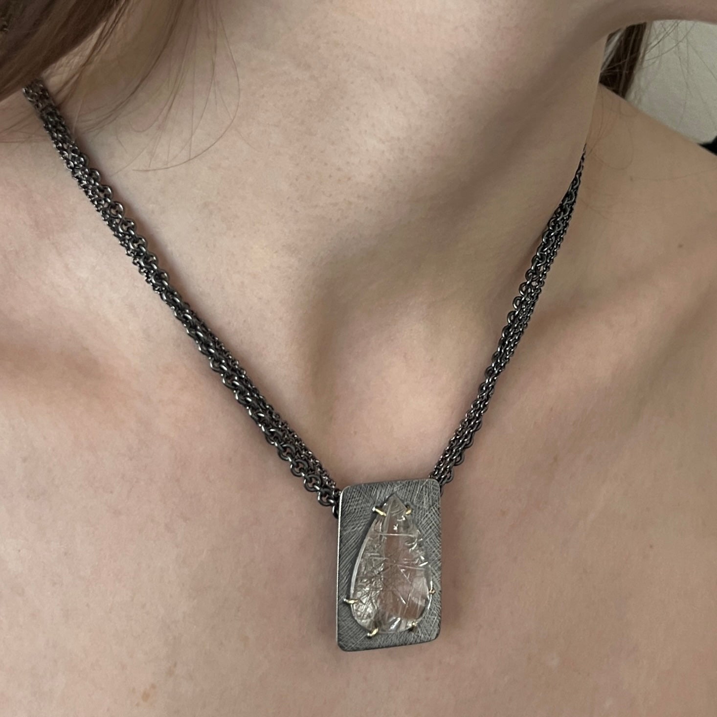 Pear shaped rutilated quartz necklace on multi-strand sterling chain
