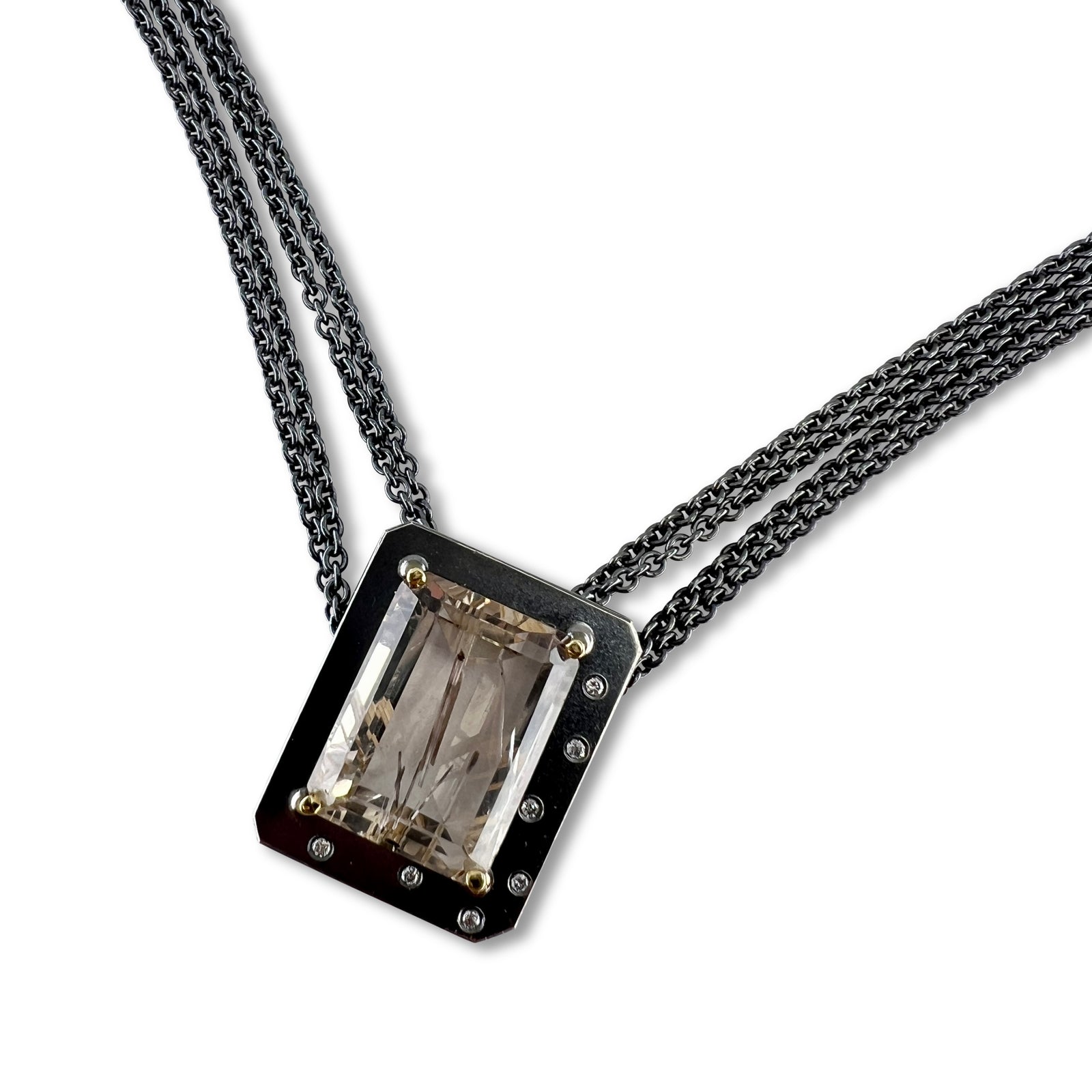 Emerald-cut rutilated quartz necklace with diamonds on a multi-strand chain