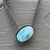 Necklace with a luscious aquamarine cabochon on a multi-strand chain