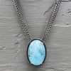 Necklace with a luscious aquamarine cabochon on a multi-strand chain