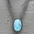 Necklace with a luscious aquamarine cabochon on a multi-strand chain