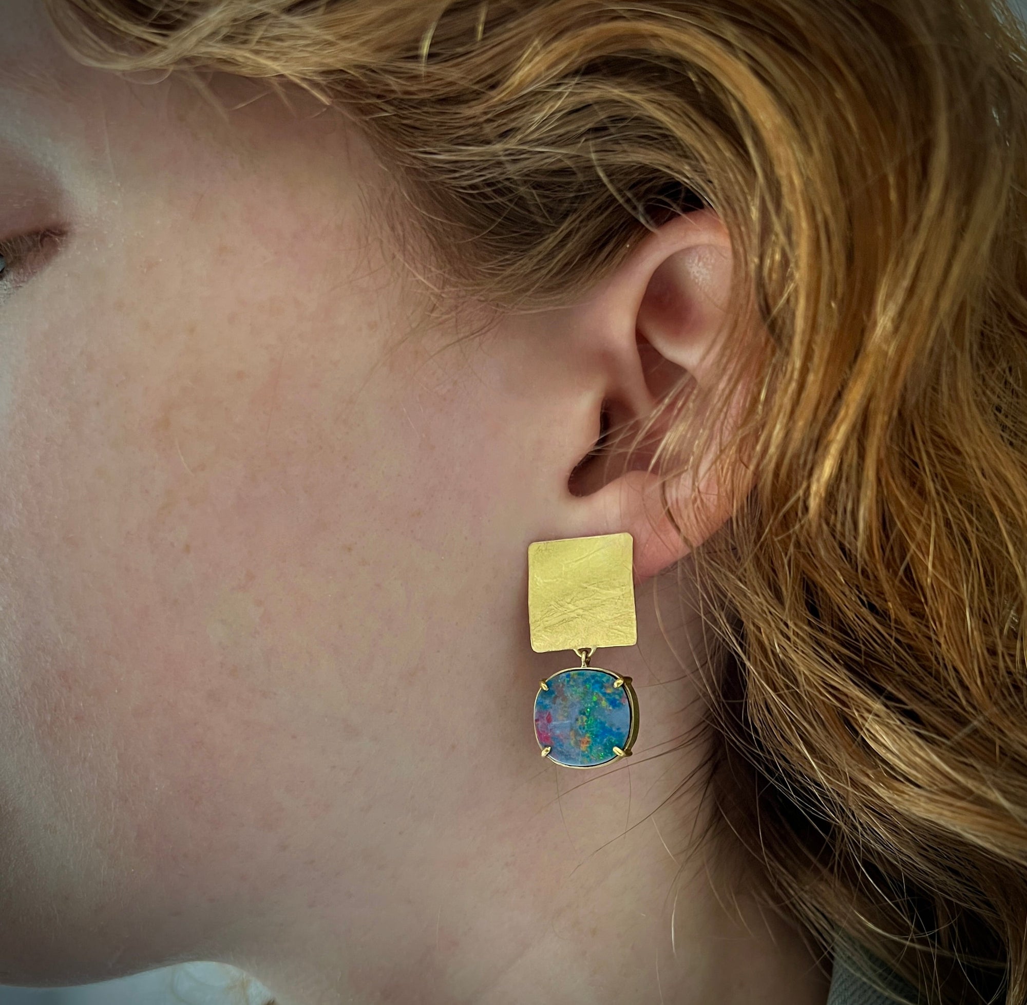 Doublet opal drops hanging from 18K yellow gold square, textured tops. Made by Ayesha Mayadas