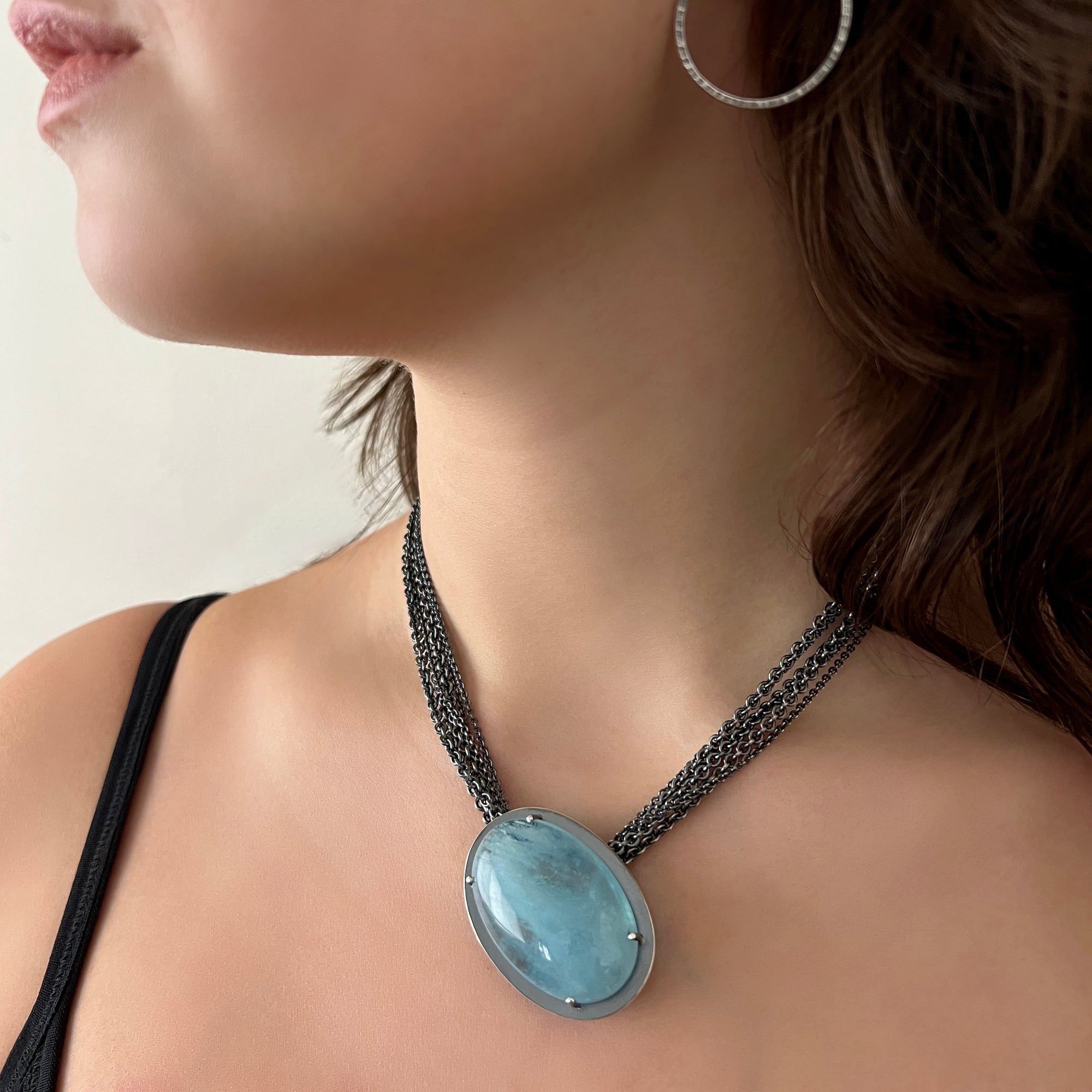 Necklace with a luscious aquamarine cabochon on a multi-strand chain