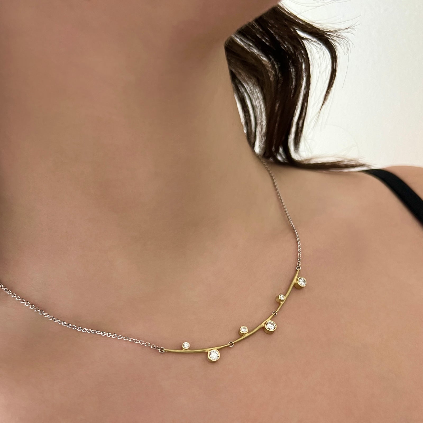Stepped necklace (3) in yellow and white gold with diamonds
