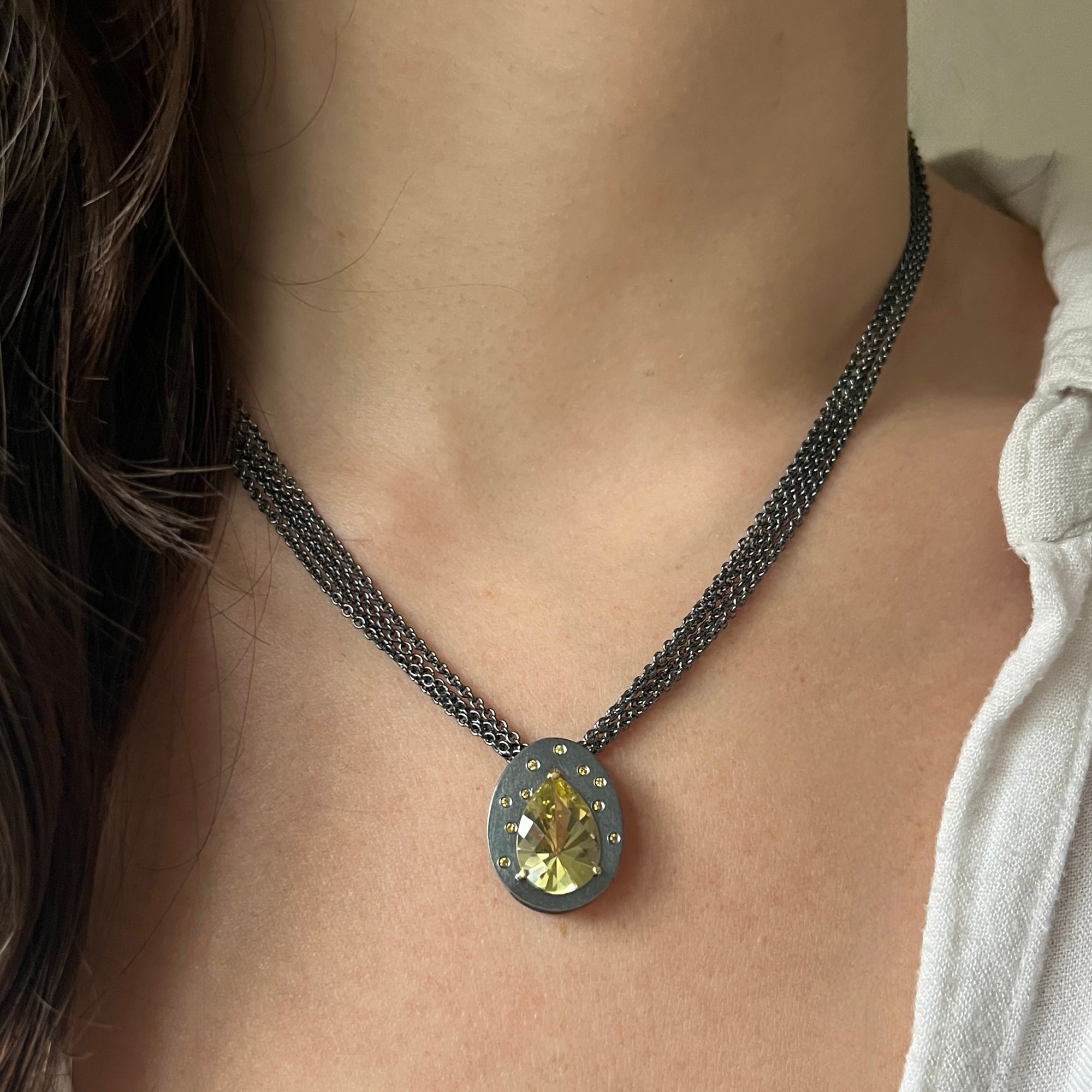 Radiant cut oro verde quartz necklace with diamonds on a multi-strand chain