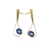 Ribbon earrings in 18K yellow gold with blue sapphires