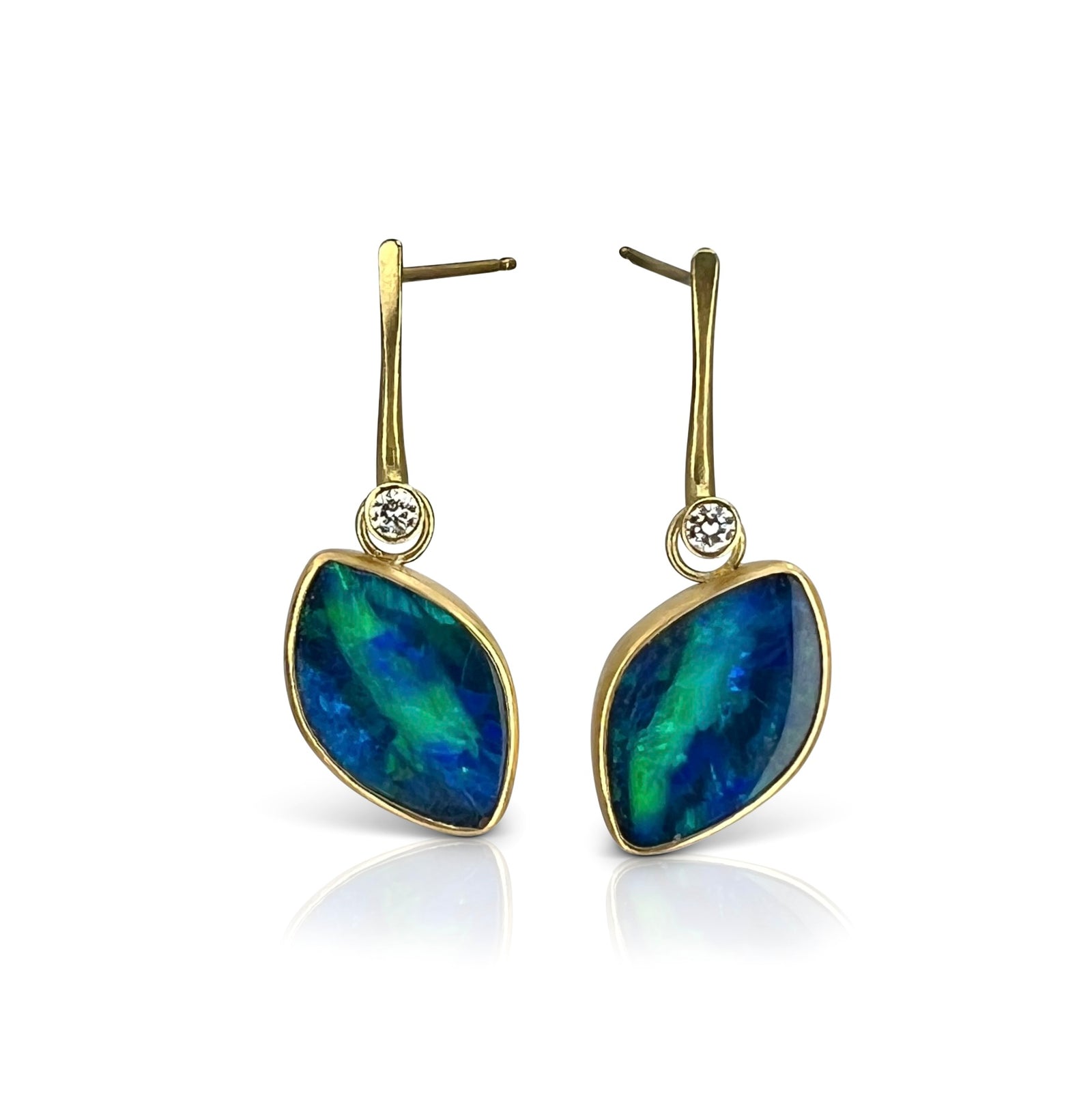 Driftwood earrings with opals suspended at an angle