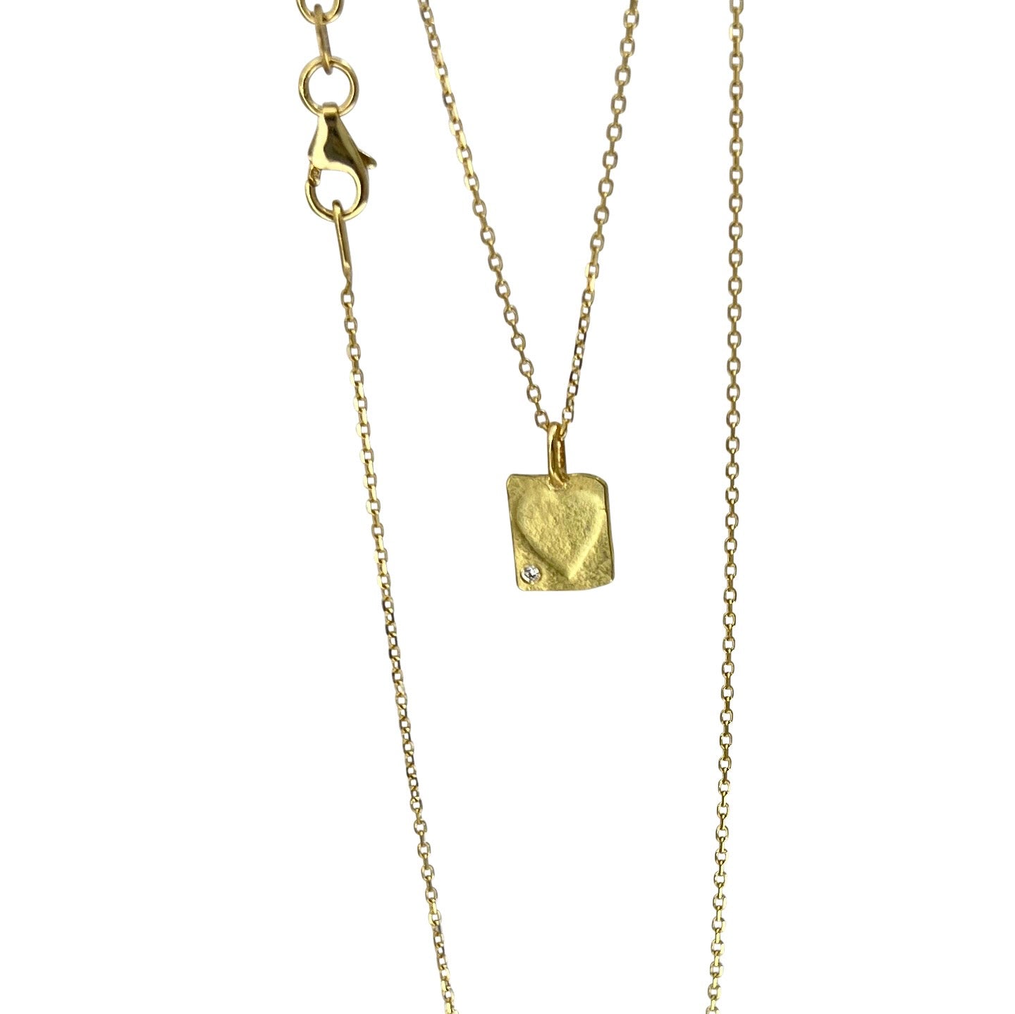 A petite heart pendant with diamond