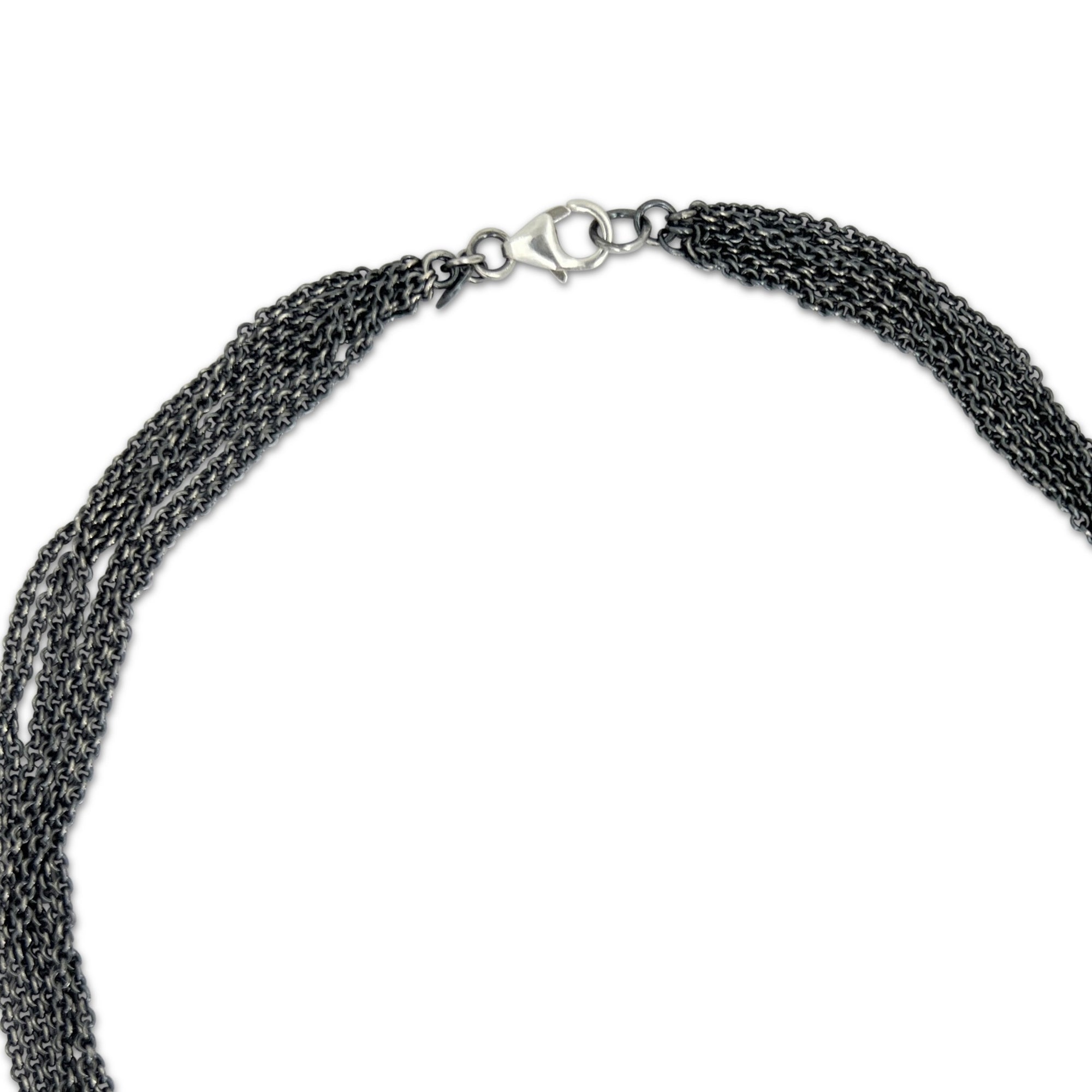 Necklace with faceted rutilated quartz with striking rutiles and a multi strand chain