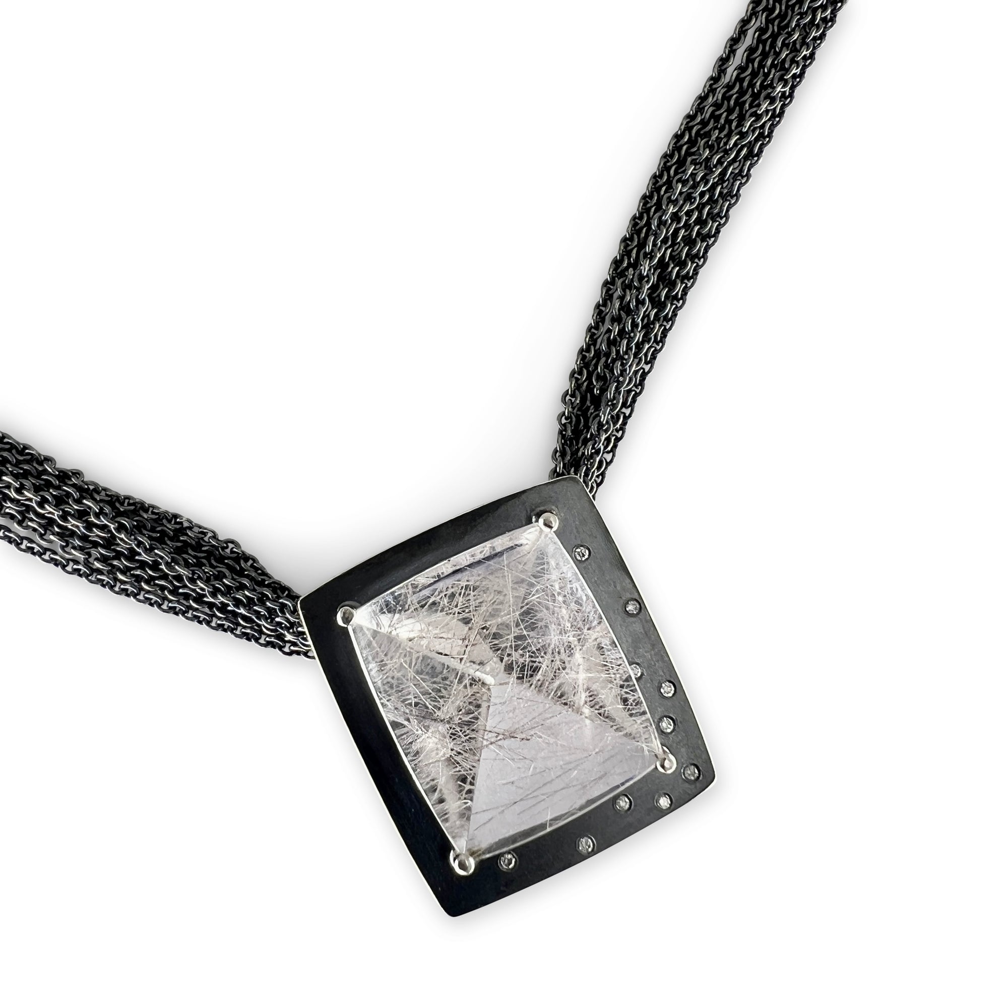 A fine, lens cut, rutilated quartz necklace with diamonds on multi sterling chain