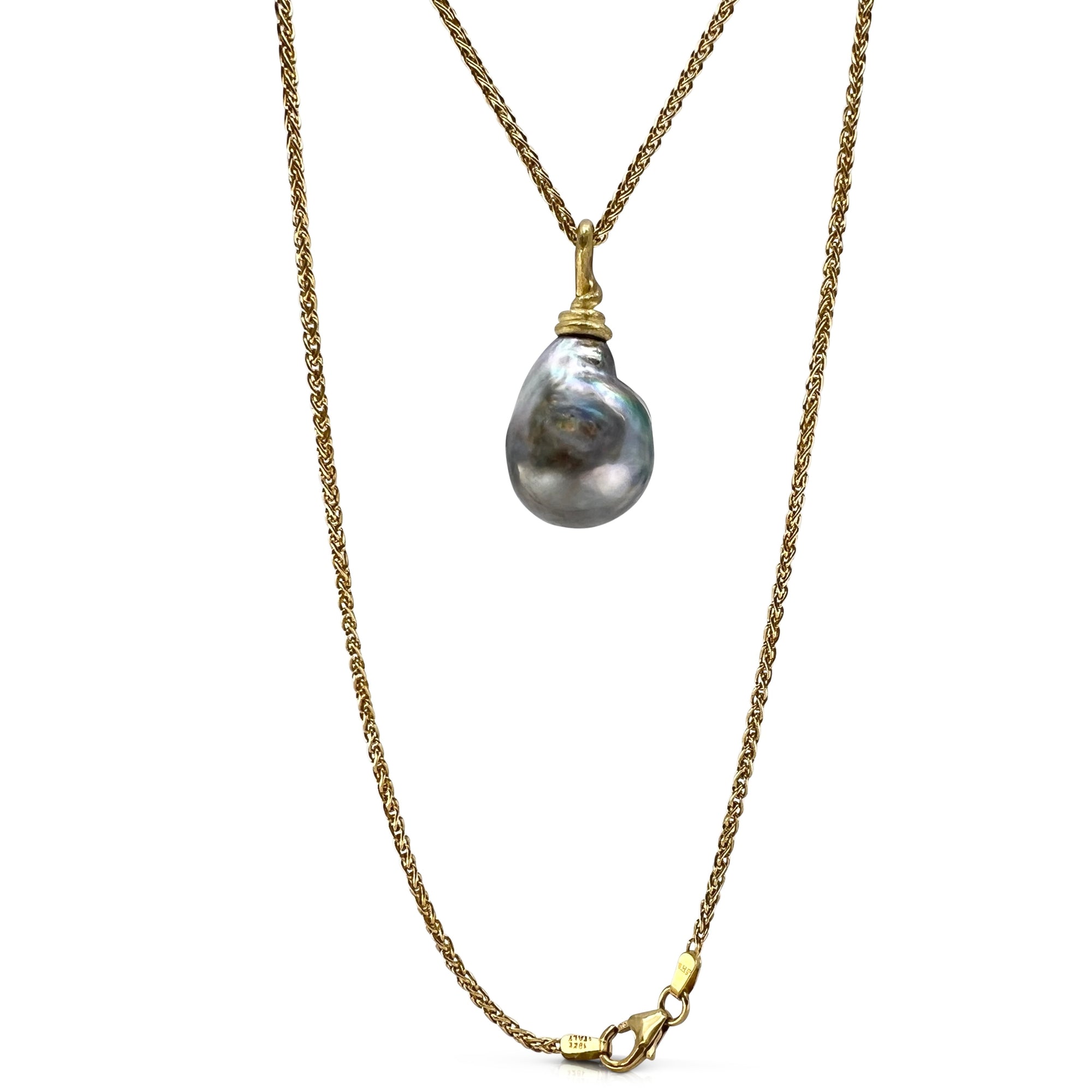 Gold necklace with a large gray tahitian pearl pendant on a white background