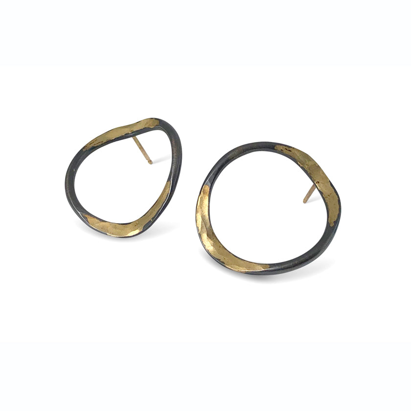 V forged hoops with a splash of 14K gold on oxidized sterling silver by Ayesha Mayadas