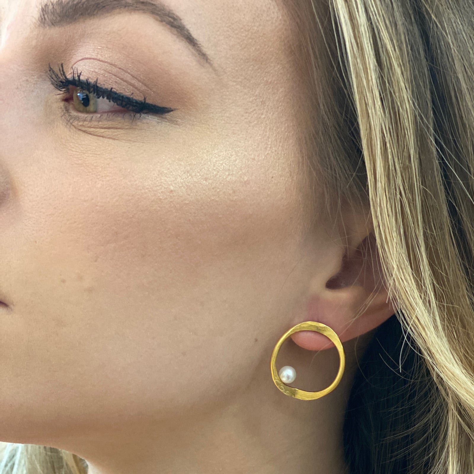 V forged hoop earrings in sterling silver with 18K yellow gold Vermeil finish and round fresh water pearls by Ayesha Mayadas