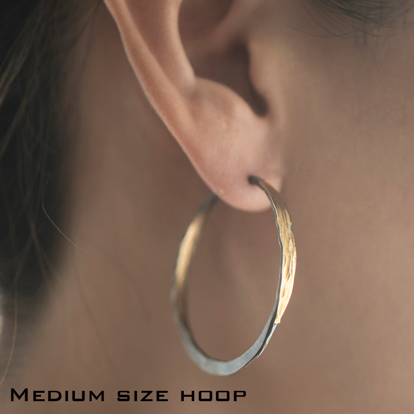 Off round Splash Hoop earrings with Barrel Closure in Sterling Silver and hammered 14K yellow gold by Ayesha Mayadas