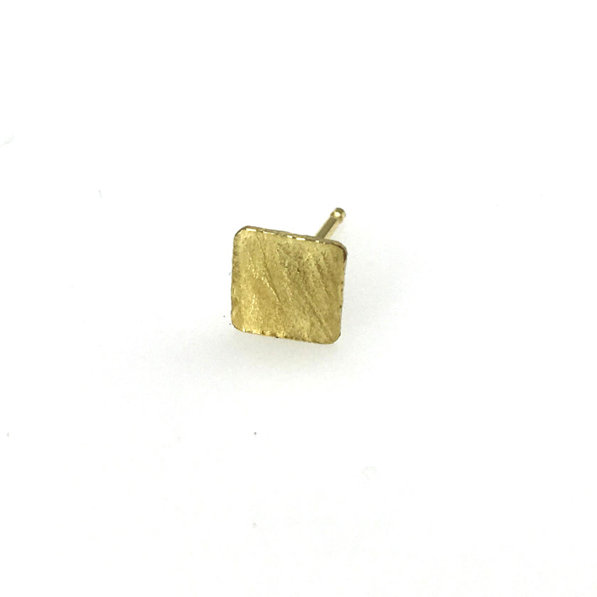 Mix-and-Match Wafer stud earrings in 18K yellow gold  shown on model post and back in 18K yellow gold by Ayesha Mayadas