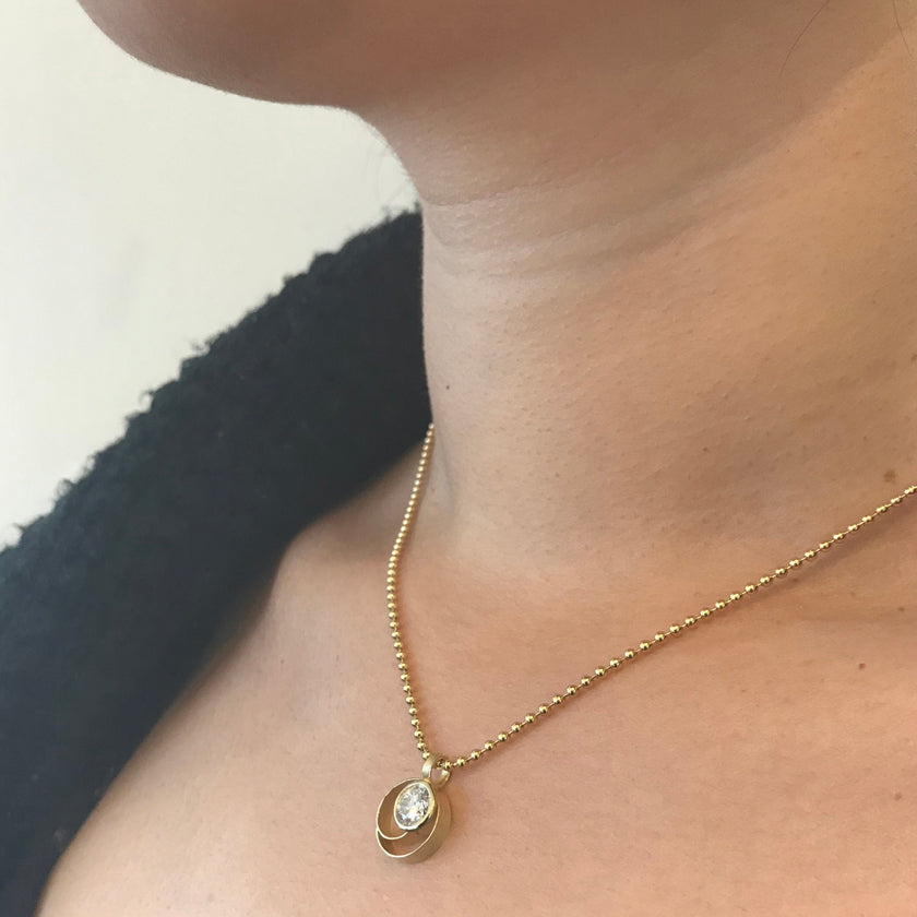 Large Coil Button Pendant in Gold with lab created diamond.