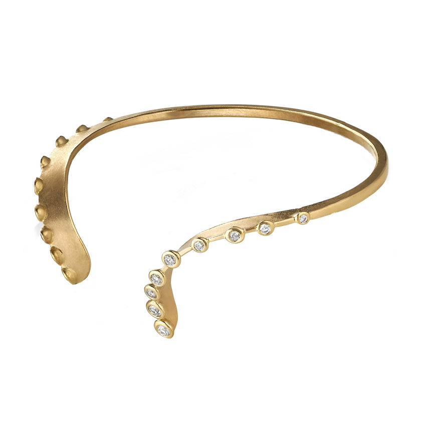 Feminine, double curved, hand forged cuff, open at the topi n 18K yellow gold with diamonds by Ayesha Mayadas
