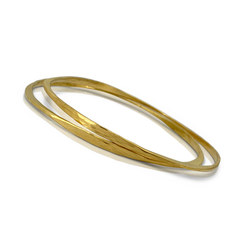 Splash off round Bangle in sterling silver with 18K yellow gold Vermeil finish by Ayesha Mayadas