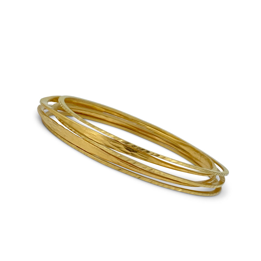 Skinny bangle in sterling silver with 18K yellow gold Vermeil finish by Ayesha Mayadas