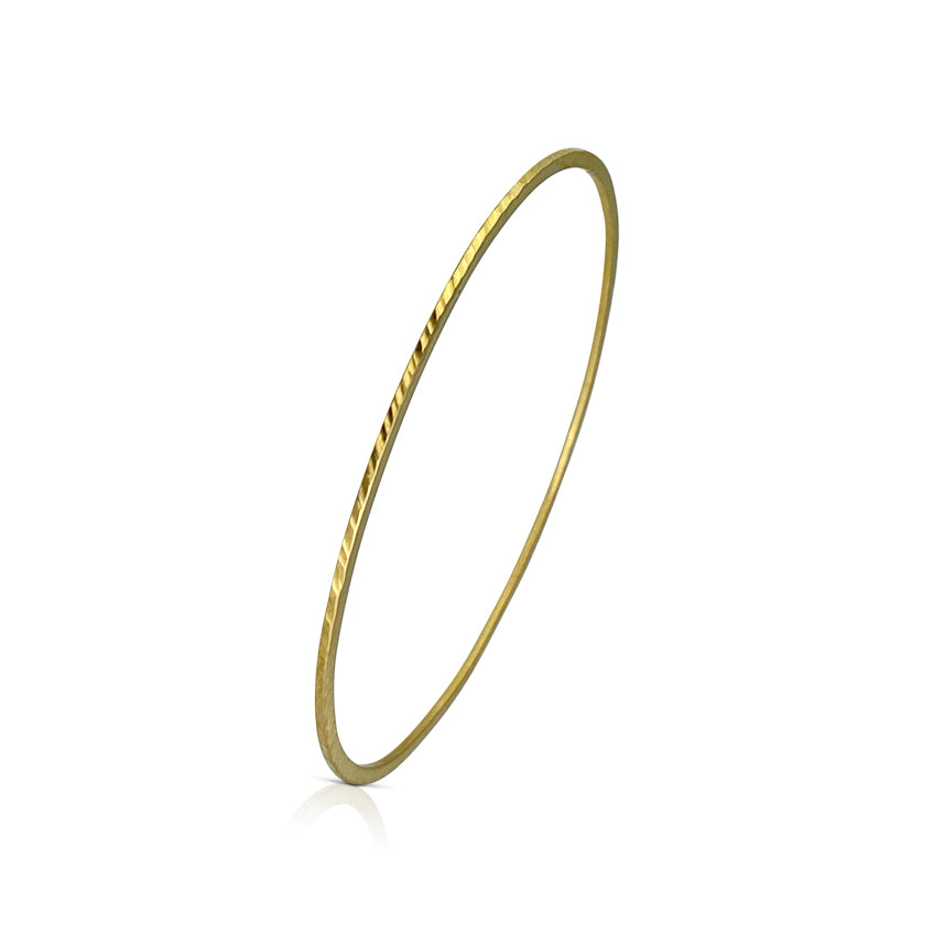 Skinny bangle in sterling silver with 18K yellow gold Vermeil finish by Ayesha Mayadas