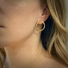 V forged hoops in sterling silver with 18K gold Vermeil finish shown on model by Ayesha Mayadas