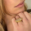 Marquis shaped Rutilated quartz ring in 18K yellow gold shown on model by Ayesha Mayadas
